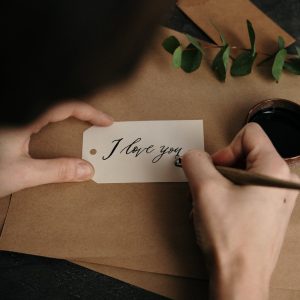 person holding white printer paper